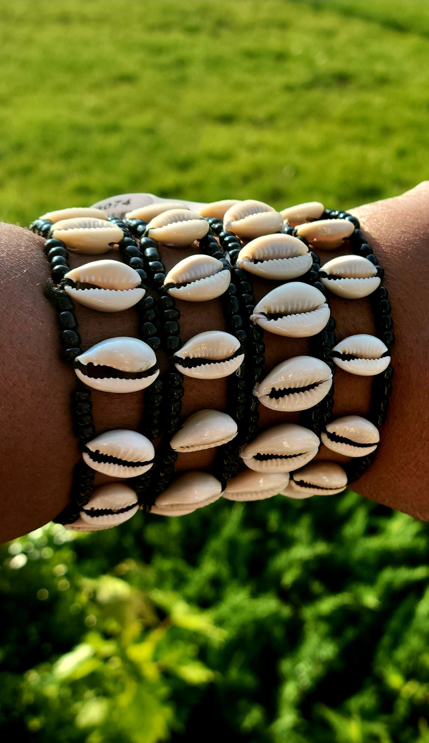 Ade's Exquisite Cowrie Shell Bracelet: A Timeless Statement of Culture and Elegance